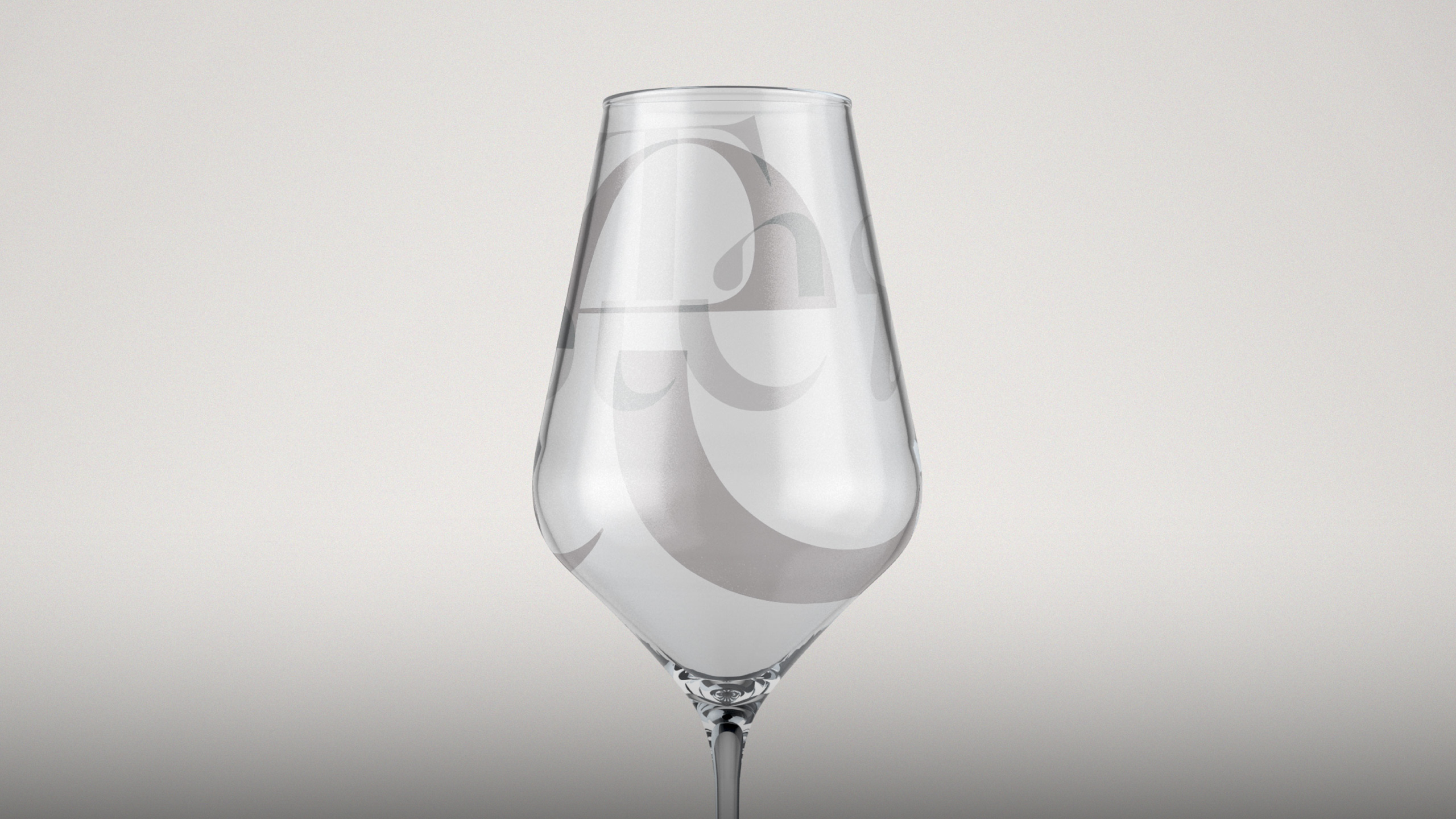 A wine glass with ‘Taste Newberg’ branding, featuring elegant typography in soft pink and gray tones.