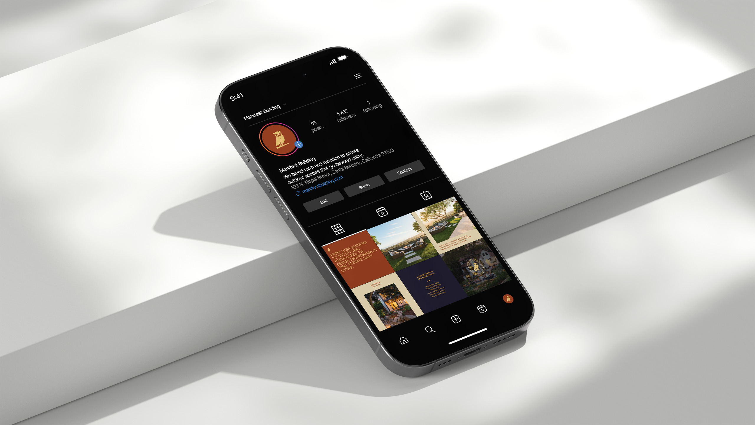 iPhone displaying the Instagram profile of Manifest Building, a Montecito-based landscape design firm in Santa Barbara. The profile features curated project images, service highlights, and the brand’s signature owl logo, reflecting luxury outdoor design and craftsmanship.