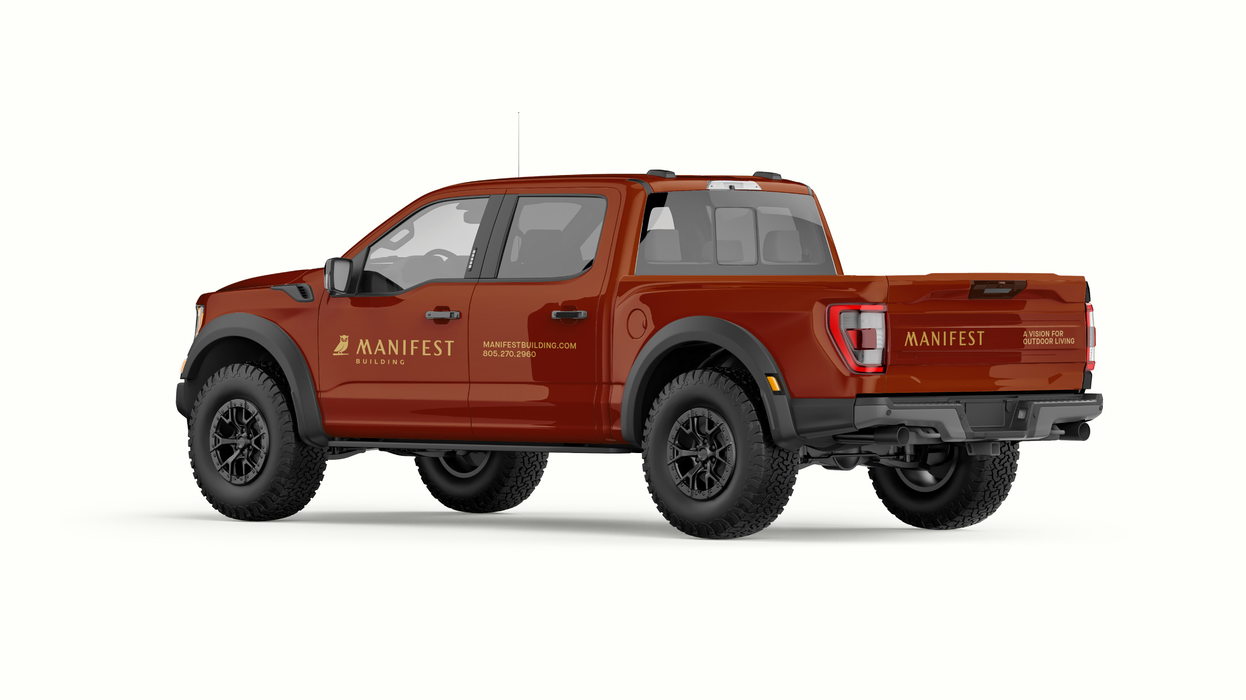 Red pickup truck featuring Manifest Building branding, including the owl logo, website URL, and tagline 